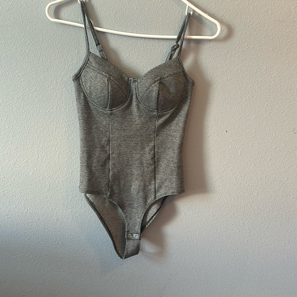 A Black and white bodysuit.